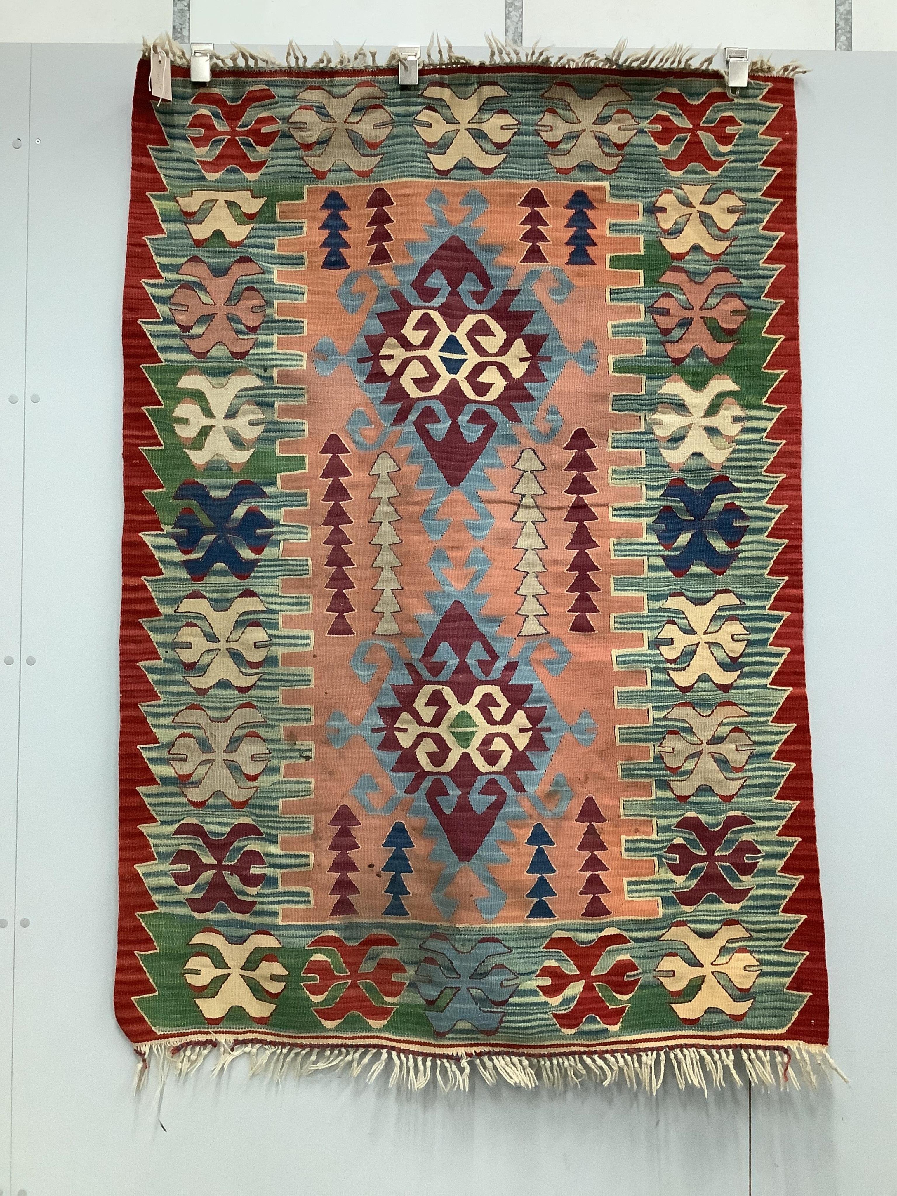 Two Kilim polychrome flatweave rugs, larger 170 x 120cm. Condition - fair